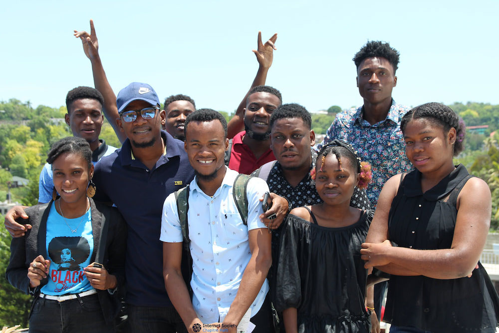 Participants at a community networks training from the Haiti Chapter stand outside